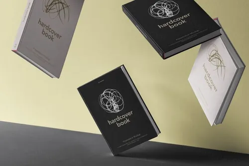 一组漂浮的psd书籍样机 Gravity Hardcover Psd Book Mockup