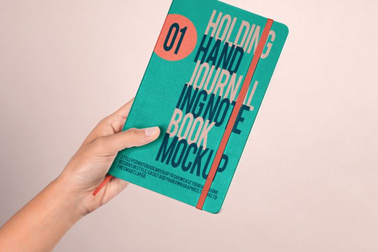 手持旅行日记本记事本场景贴图展示样机模板 Hand Holding Psd Notebook Mockup 2